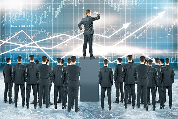 Businessman standing on pedestal and looking into the distance with other businesspeople around on forex chart background. Leadership concept